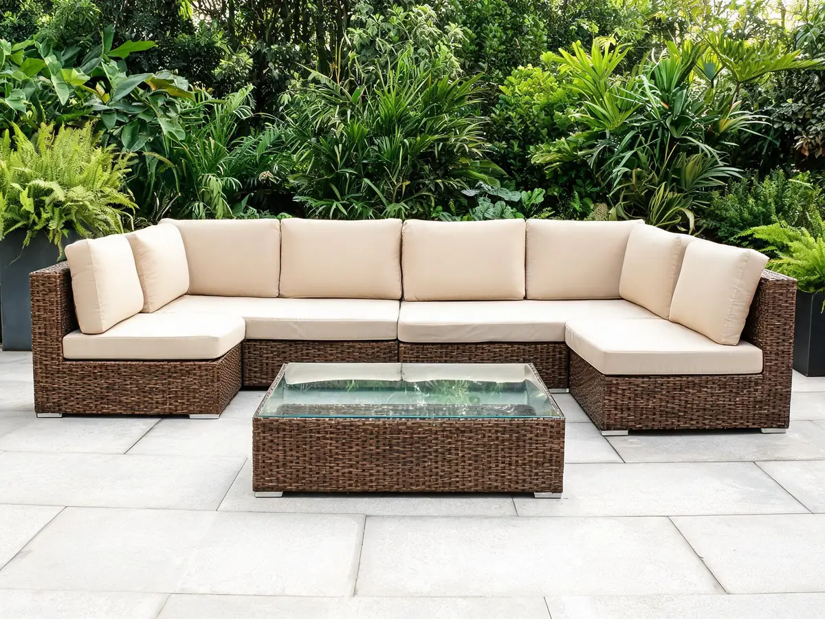 Modular brown rattan garden sofa set with beige cushions